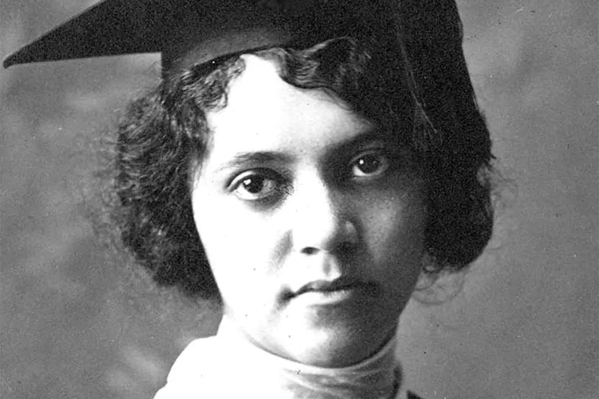 Black-and-white portrait of chemist Alice Ball in a graduation cap